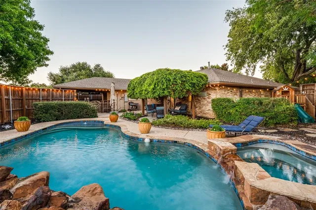 a view of swimming pool having patio