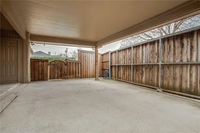 an empty room with furniture and a window