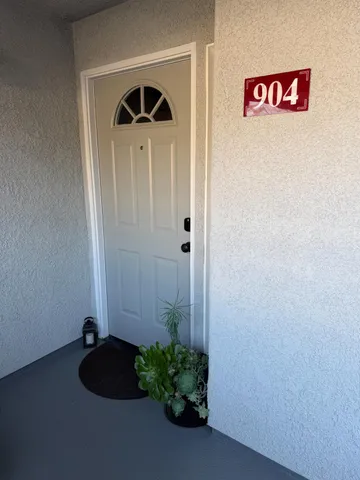 a kitchen with a sink appliances and cabinets