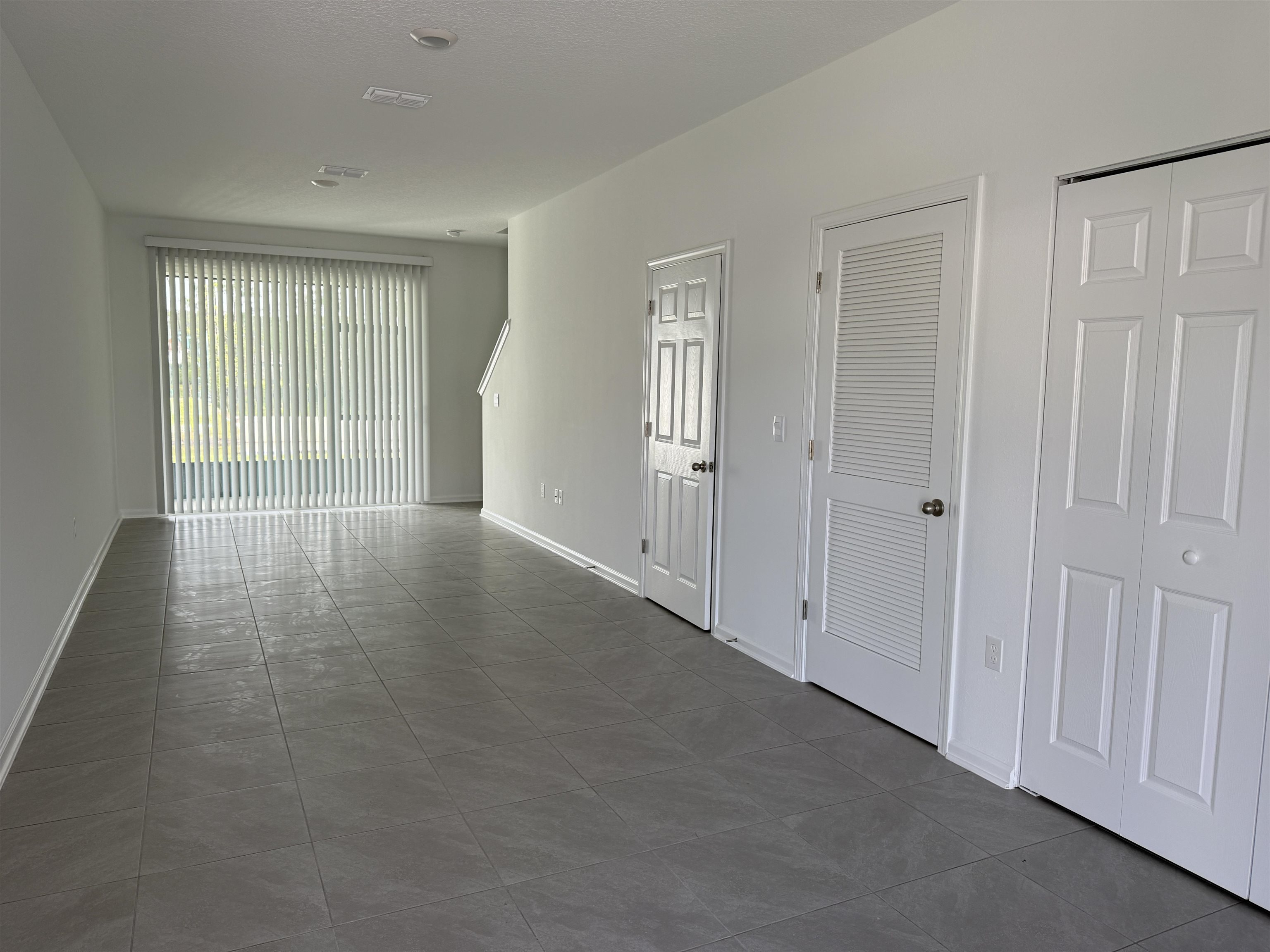 82 Crisanto Road St. Augustine, FL 32084 - Photo 3 of 12 wooden floor in an empty room with a window