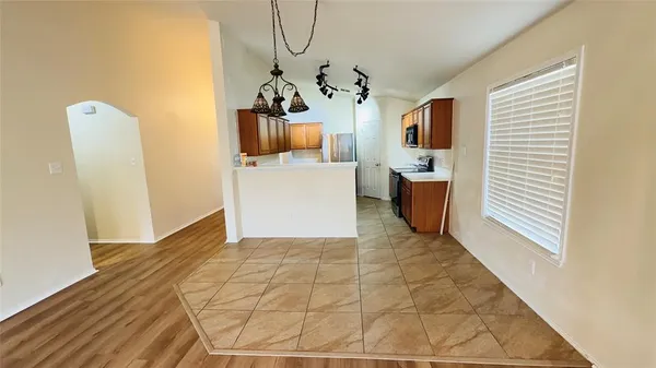 a view of an entryway with wooden floor