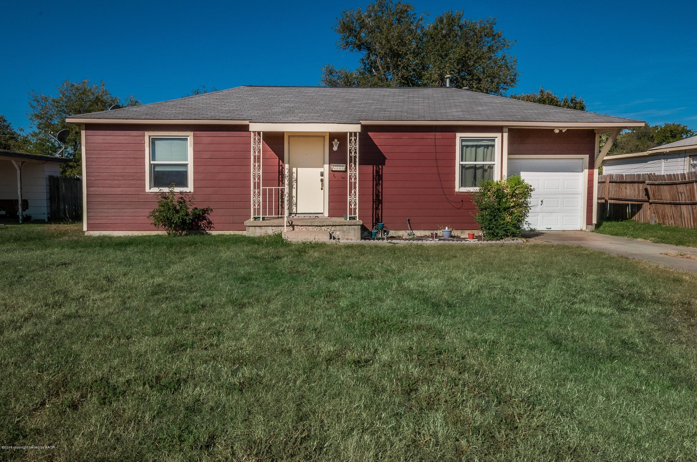 4402 Parker Street Amarillo, TX 79110 - Photo 2 of 21 front view of a house and a yard
