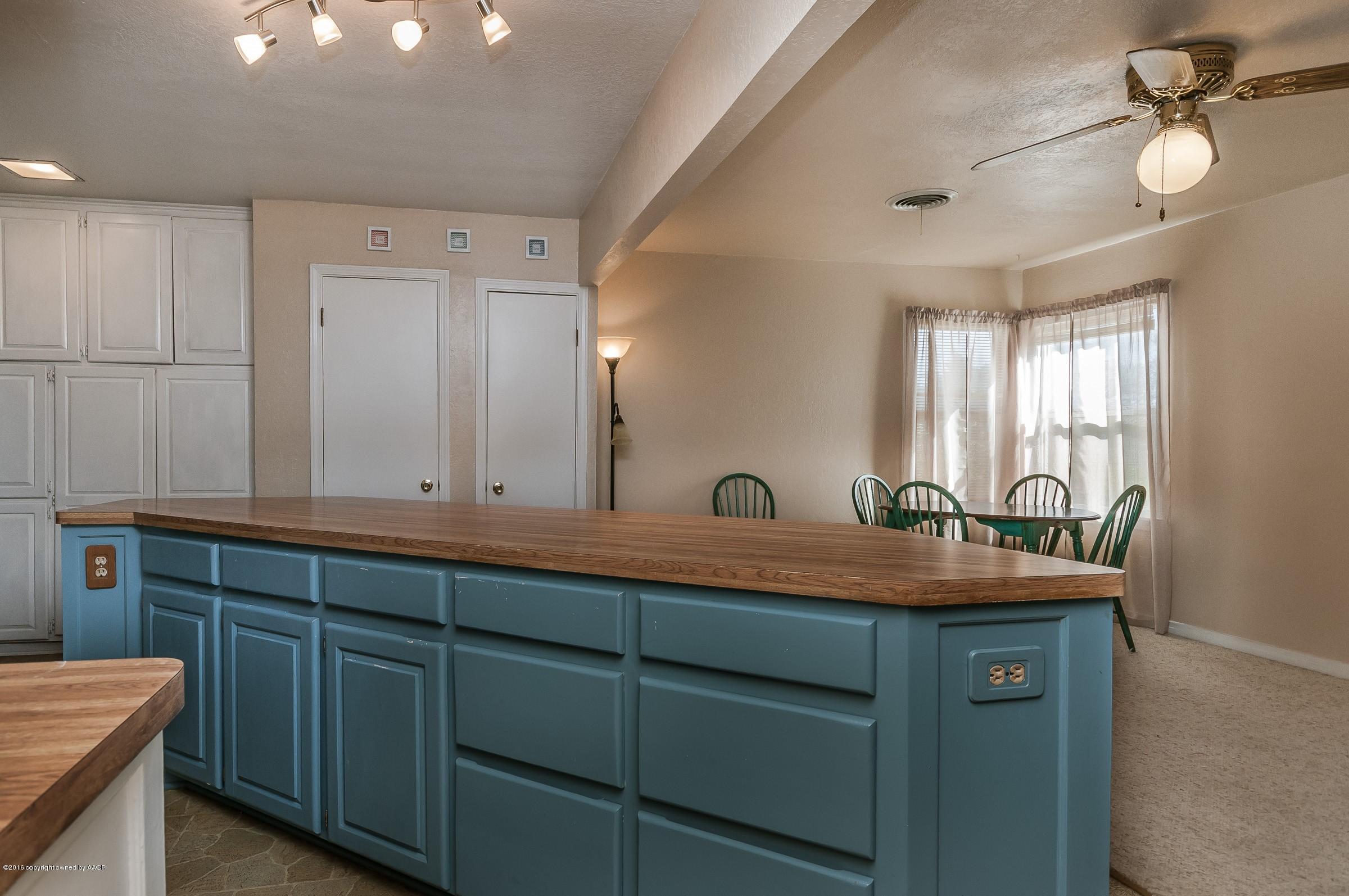 4402 Parker Street Amarillo, TX 79110 - Photo 6 of 21 a bathroom with a sink and two mirror