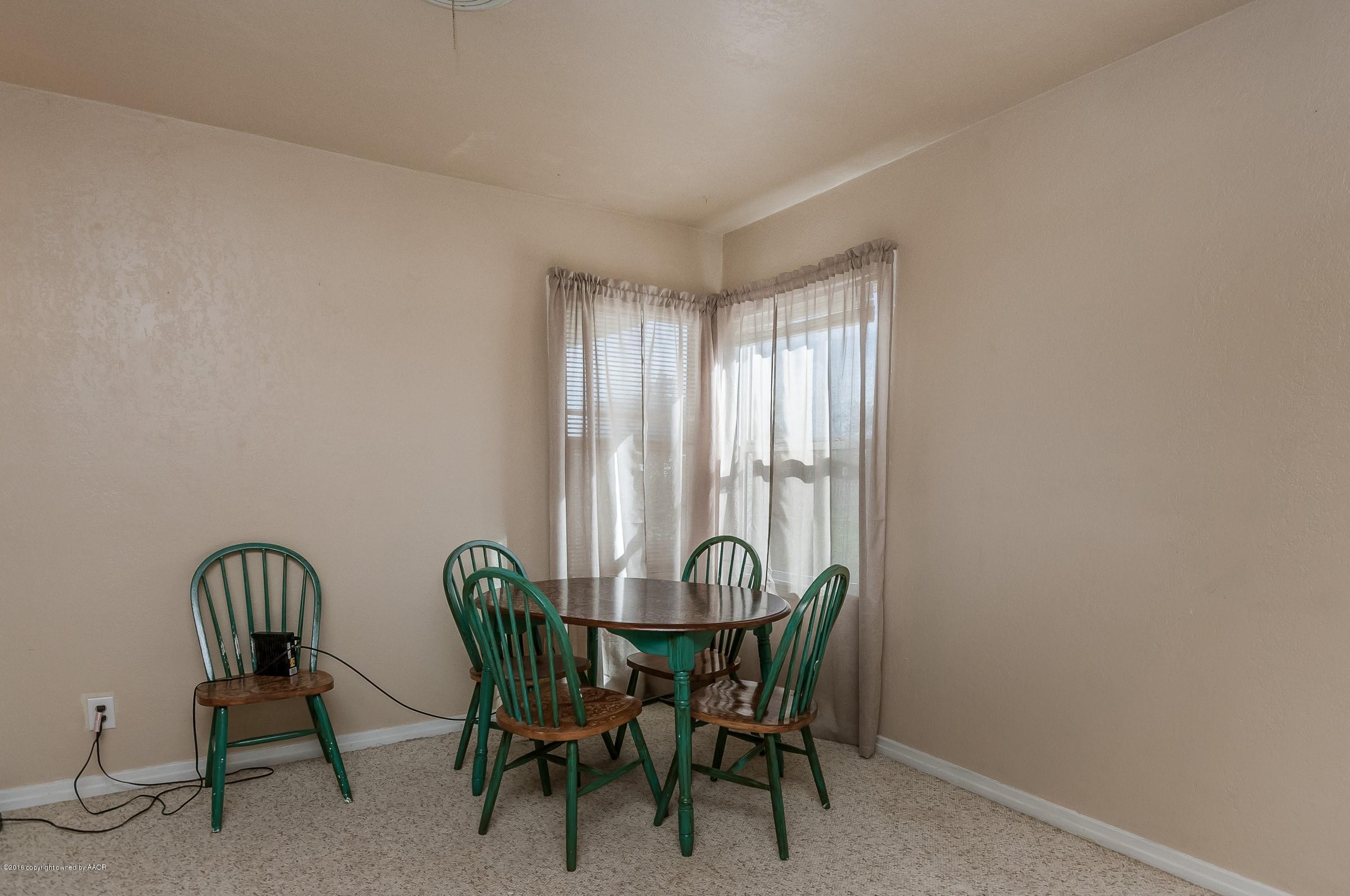 4402 Parker Street Amarillo, TX 79110 - Photo 10 of 21 a view of a dining room with furniture and window
