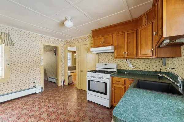 a kitchen with a stove and a sink