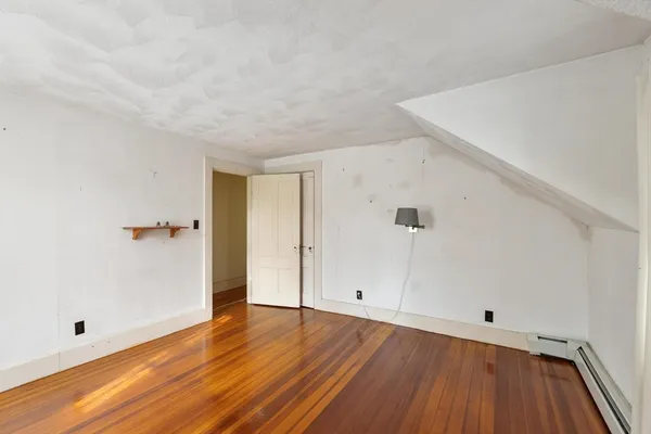 a view of room with wooden floor