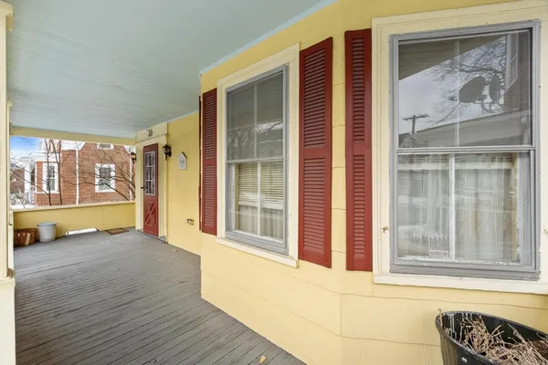 a view of front door of house with wooden floor