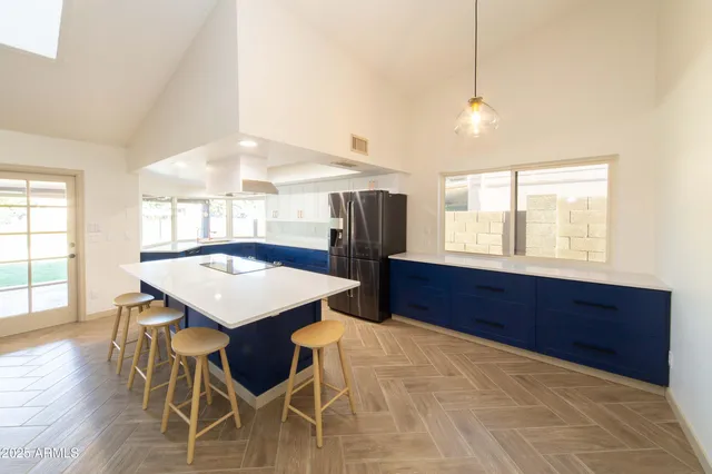 a kitchen with a table and chairs in it