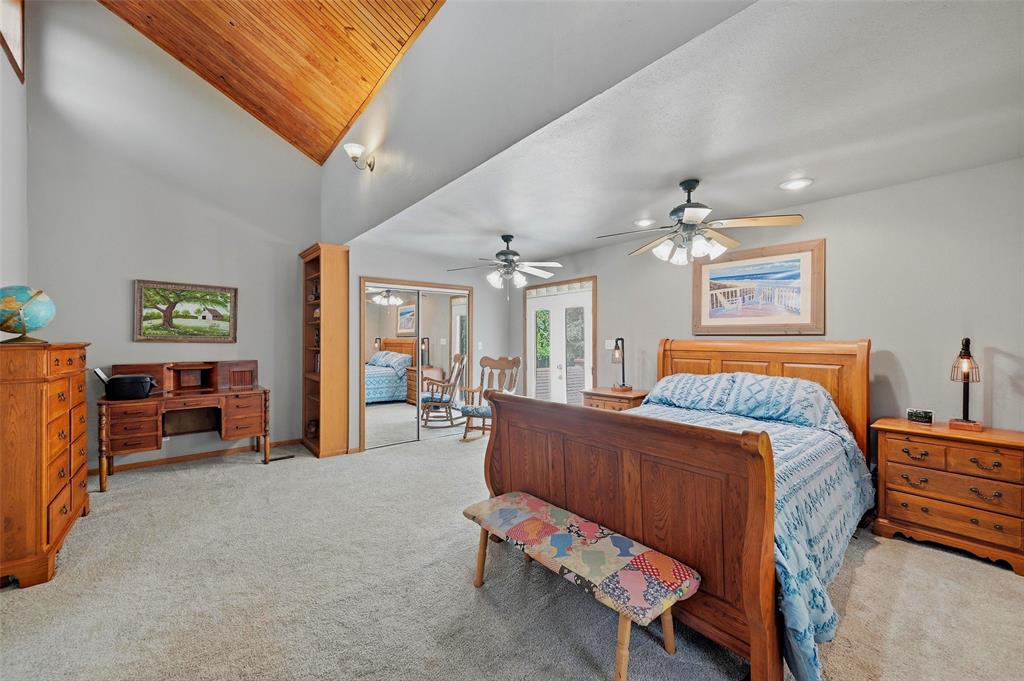 522 High Country Road Sherman, TX 75092 - Photo 22 of 38 a bed room with furniture and a chandelier