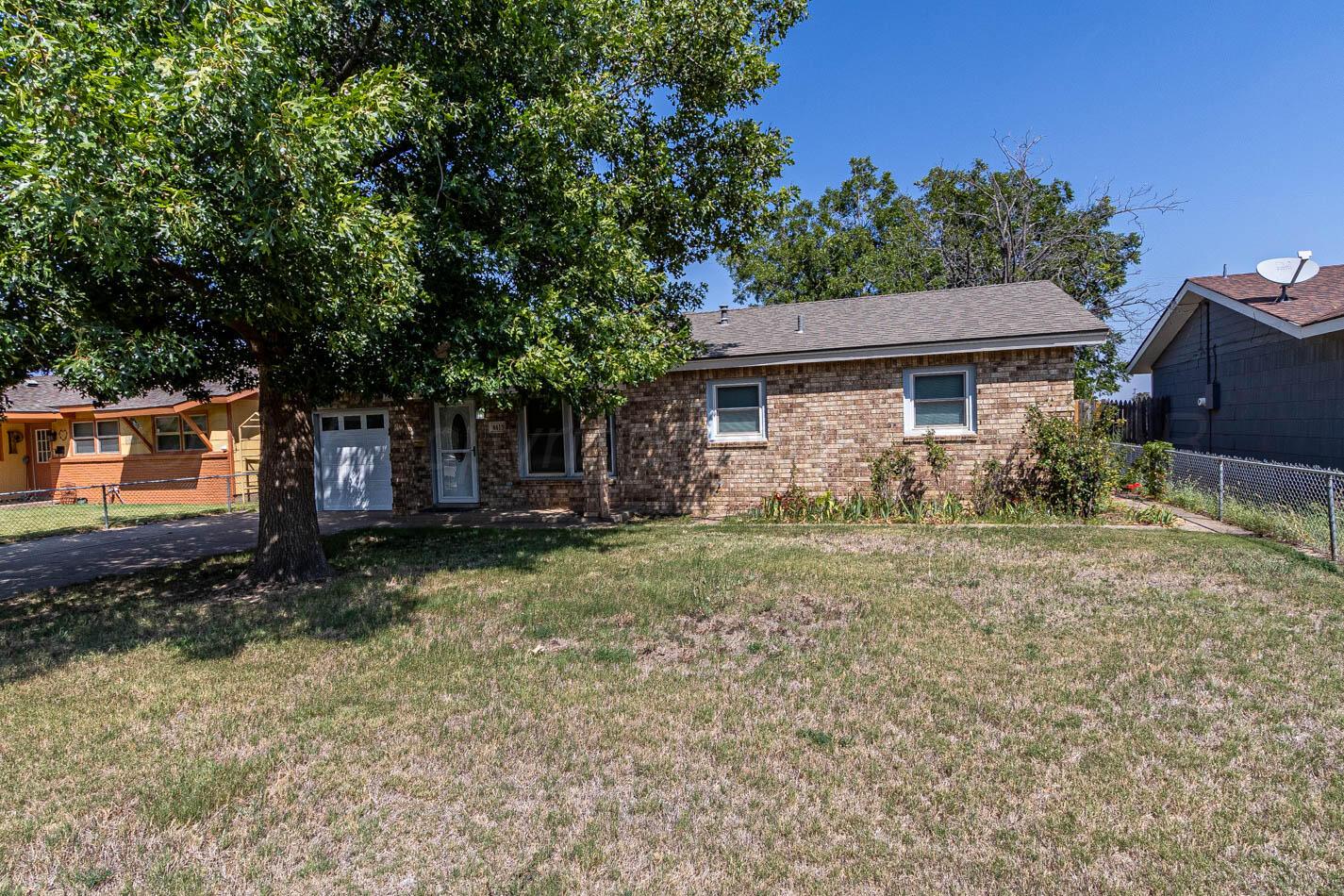 4413 Southeast 28th Avenue Amarillo, TX 79103 - Photo 2 of 13 a view of a house with a yard