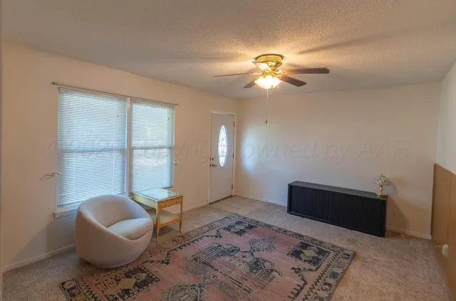 a living room with furniture and a window