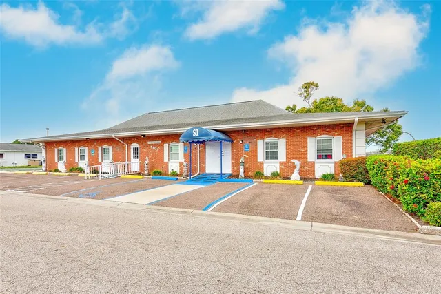 a view of a dining room with furniture and a wooden floor