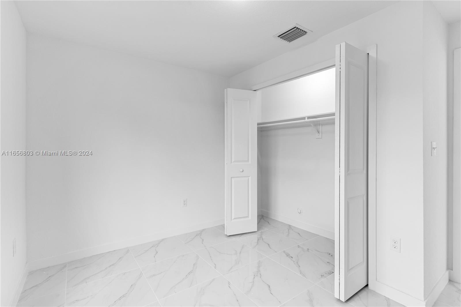 1801 Northwest 112th Street, Unit 1 Miami, FL 33167 - Photo 11 of 22 a view of an empty room