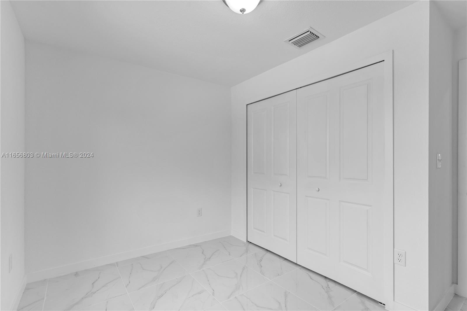 1801 Northwest 112th Street, Unit 1 Miami, FL 33167 - Photo 19 of 22 a view of an empty room