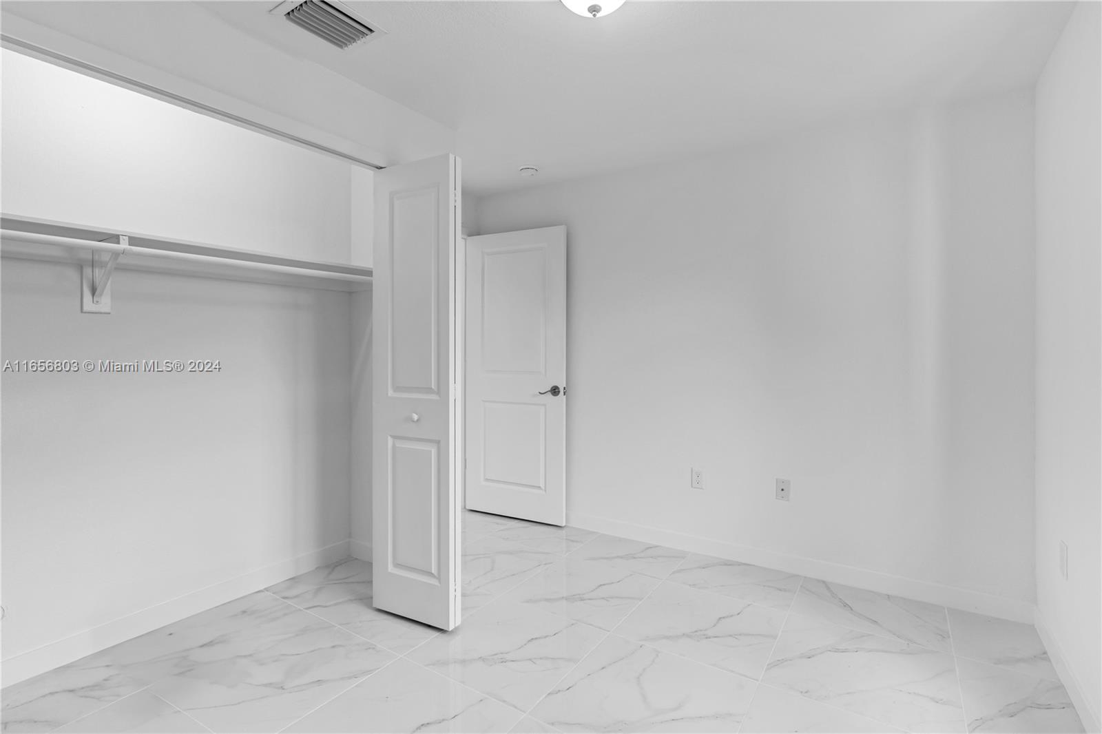 1801 Northwest 112th Street, Unit 1 Miami, FL 33167 - Photo 20 of 22 a view of an empty room