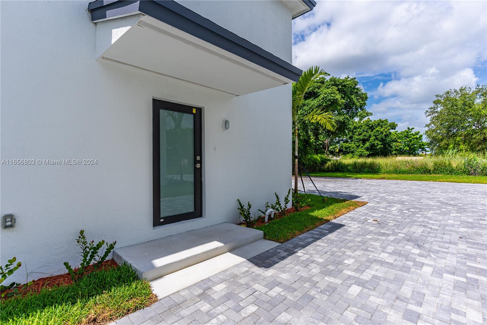 1801 Northwest 112th Street, Unit 1 Miami, FL 33167 - Photo 21 of 22 a front view of a house with garden