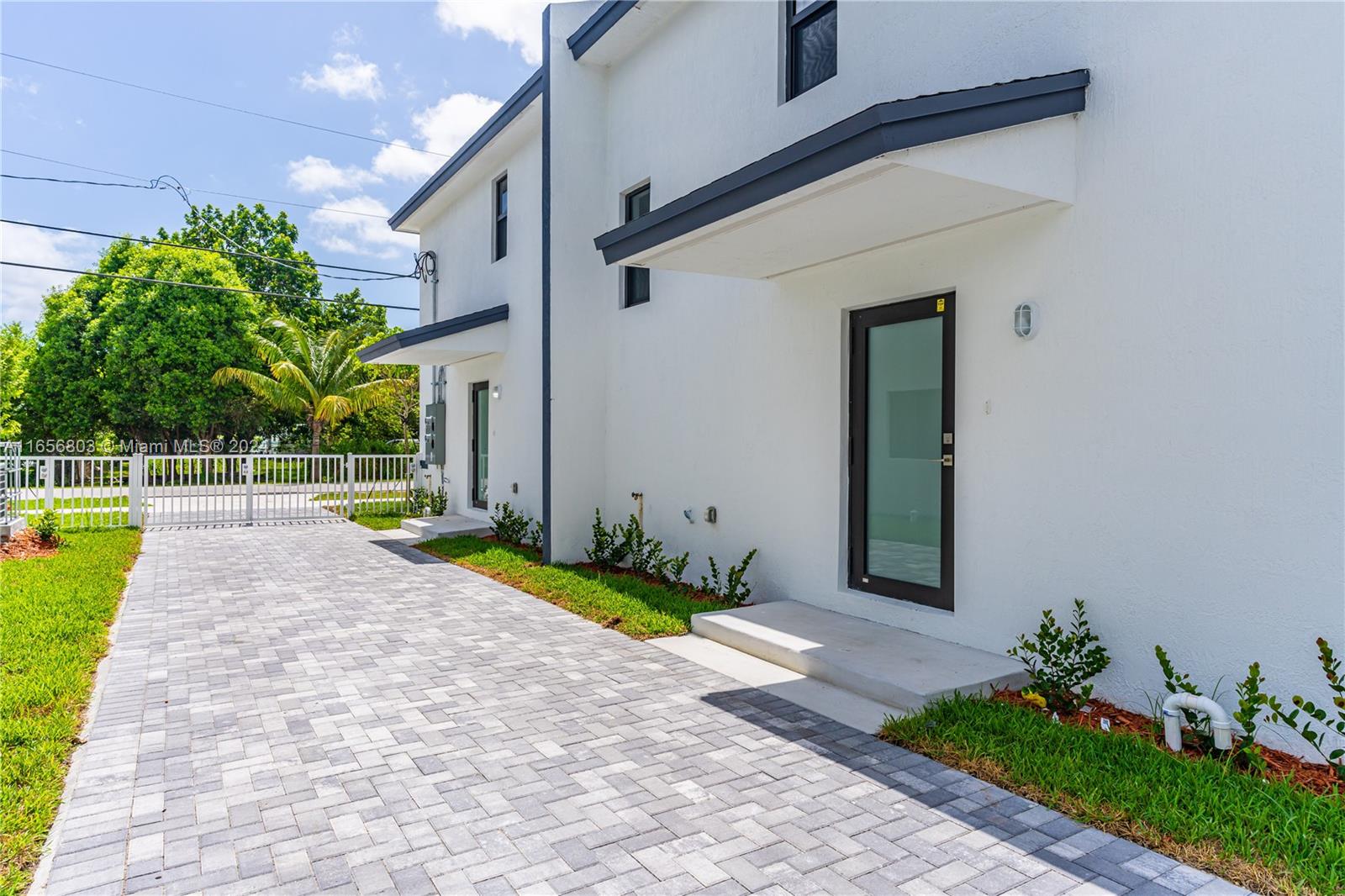1801 Northwest 112th Street, Unit 1 Miami, FL 33167 - Photo 22 of 22 a front view of a house with garden