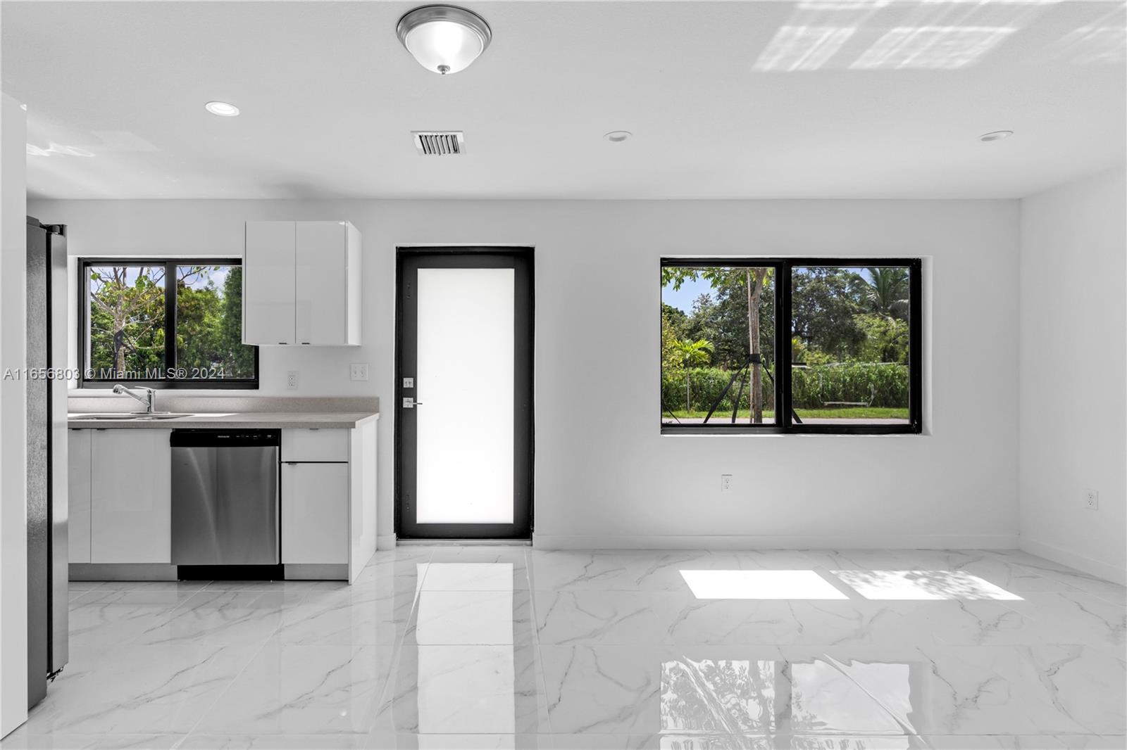 1801 Northwest 112th Street, Unit 1 Miami, FL 33167 - Photo 7 of 22 a kitchen with a sink and window
