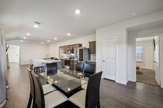 a view of a dining room with furniture