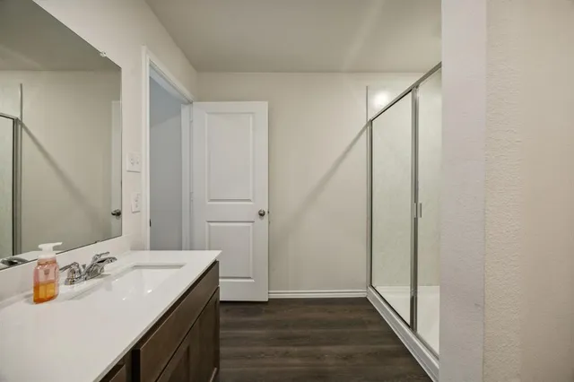 a bathroom with a sink and a mirror