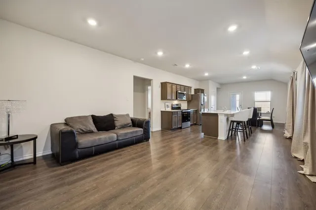 a living room with furniture and a table