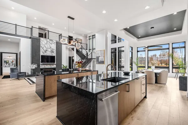 a kitchen with sink stove and cabinets