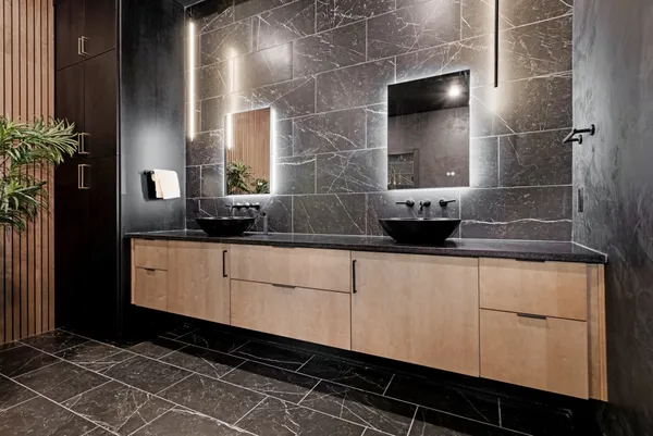 a bathroom with a double vanity sink and mirror