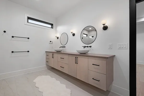 a bathroom with a toilet a sink and a mirror