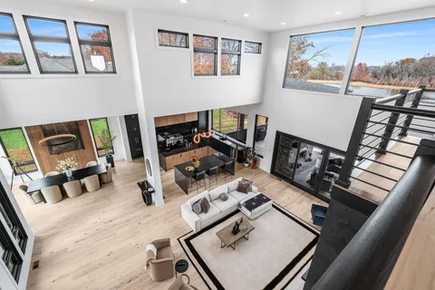 a dining room with furniture and wooden floor