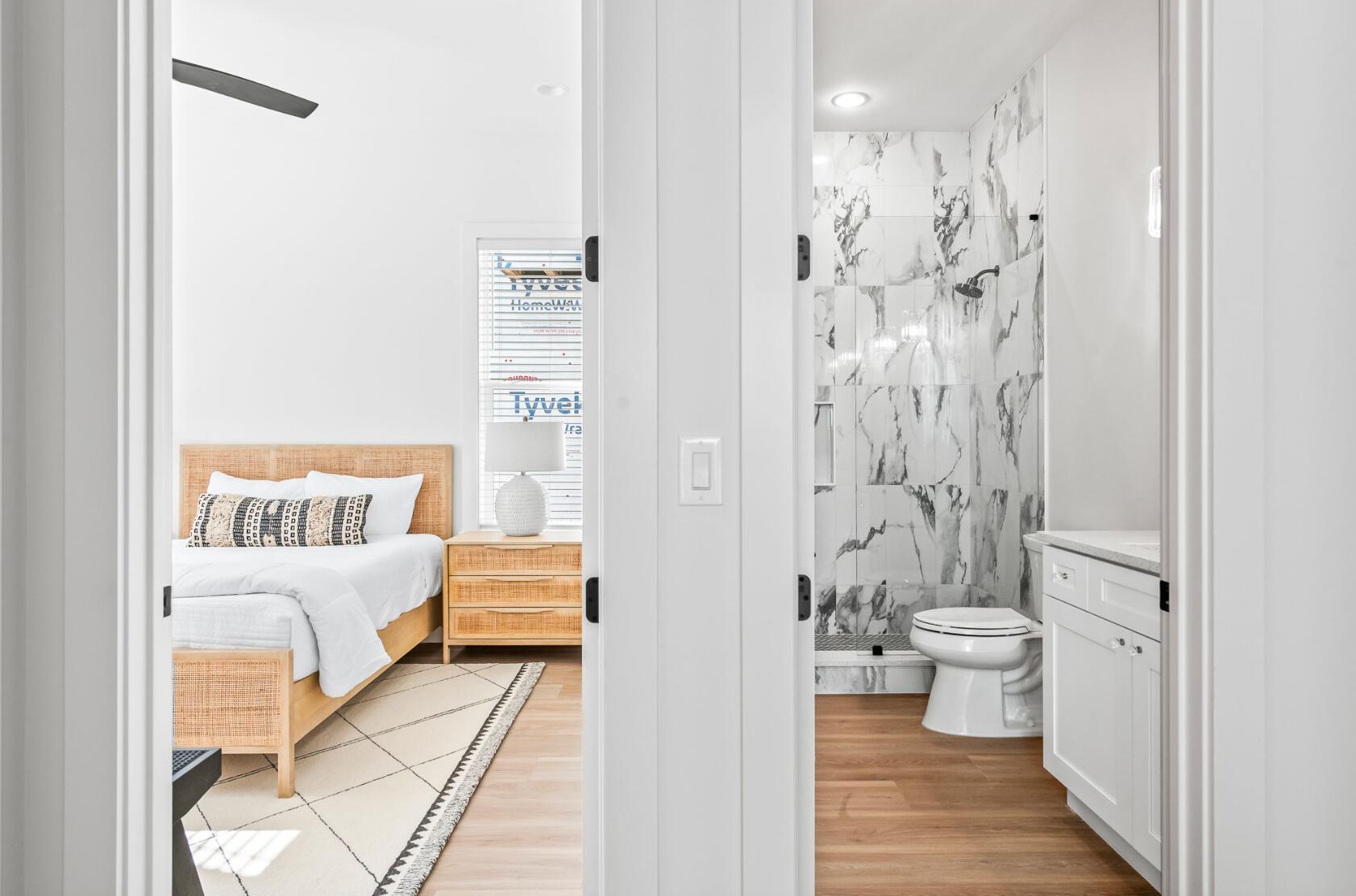 205 Redbud Ln Inlet Beach Inlet Beach, FL 32461 - Photo 18 of 34 a en suite bathroom with a shower curtain and a toilet