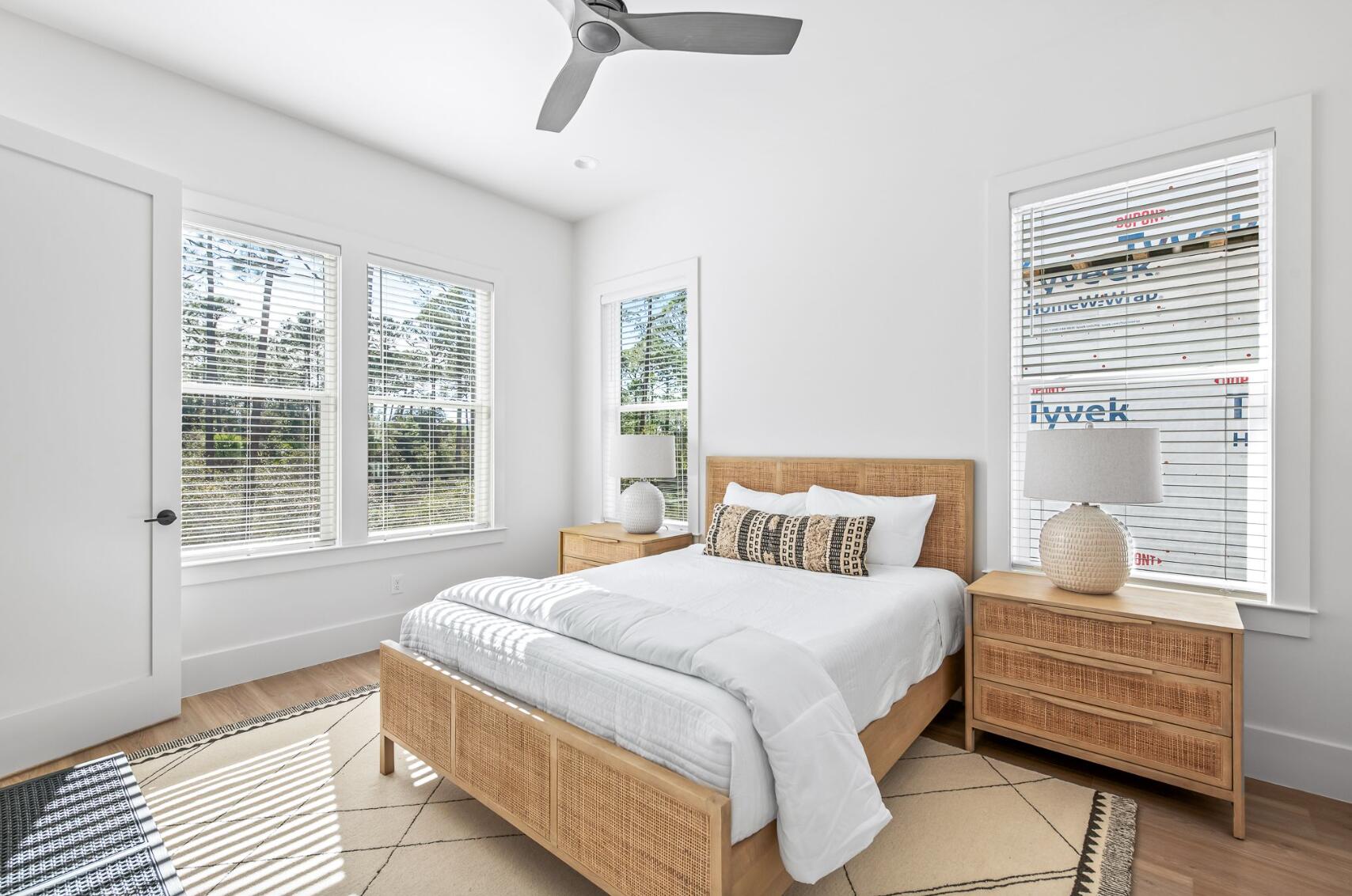 205 Redbud Ln Inlet Beach Inlet Beach, FL 32461 - Photo 21 of 34 a large bed sitting in a bedroom next to a window