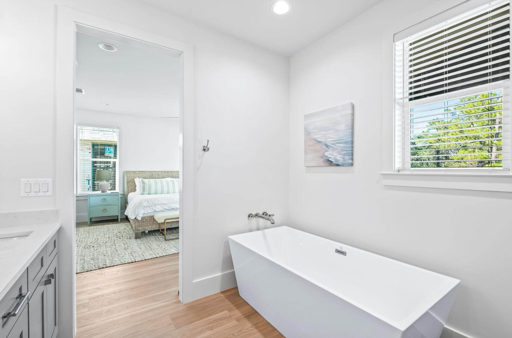 205 Redbud Ln Inlet Beach Inlet Beach, FL 32461 - Photo 24 of 34 a bathroom with a tub shower and bedroom view