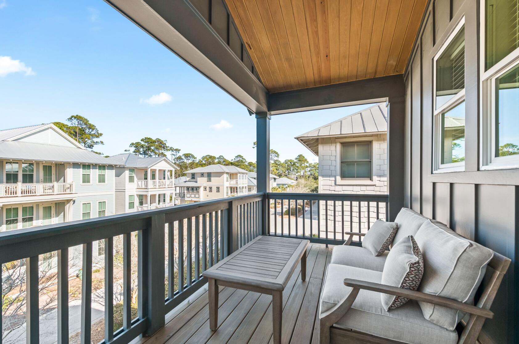 205 Redbud Ln Inlet Beach Inlet Beach, FL 32461 - Photo 25 of 34 a view of a city from a balcony with furniture