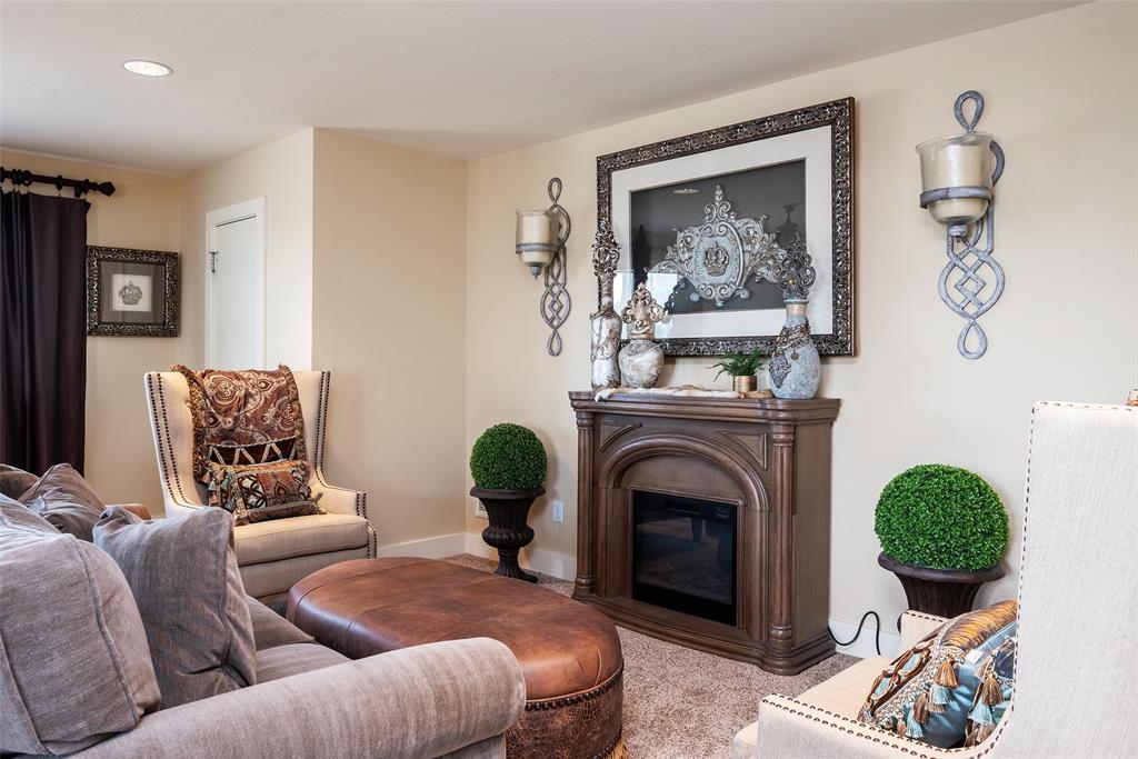 2312 Cactus Rio Lane Weatherford, TX 76087 - Photo 24 of 37 a living room with furniture and a fireplace