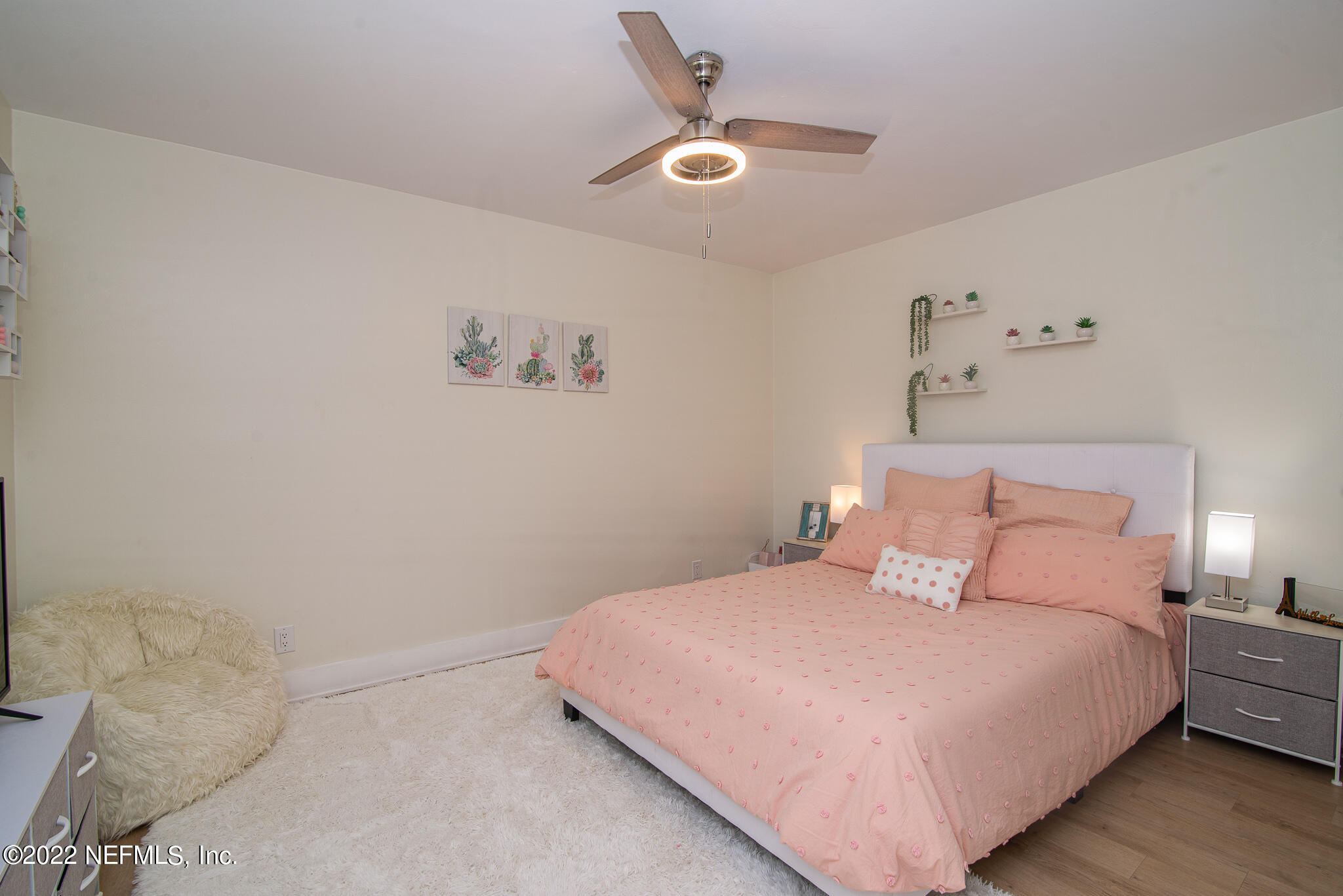 4268 Heath Road Jacksonville, FL 32277 - Photo 23 of 43 a bedroom with a bed and a ceiling fan