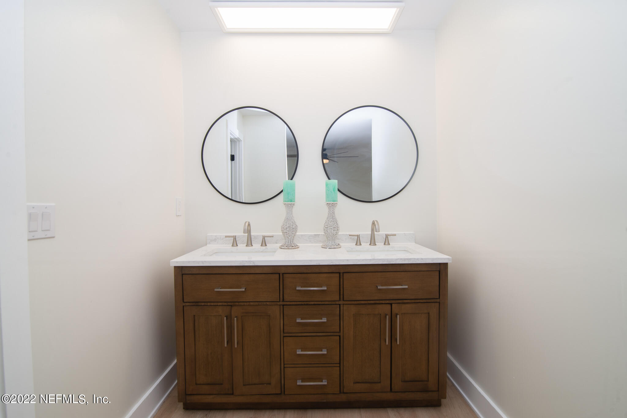 4268 Heath Road Jacksonville, FL 32277 - Photo 31 of 43 a bathroom with a sink and a mirror