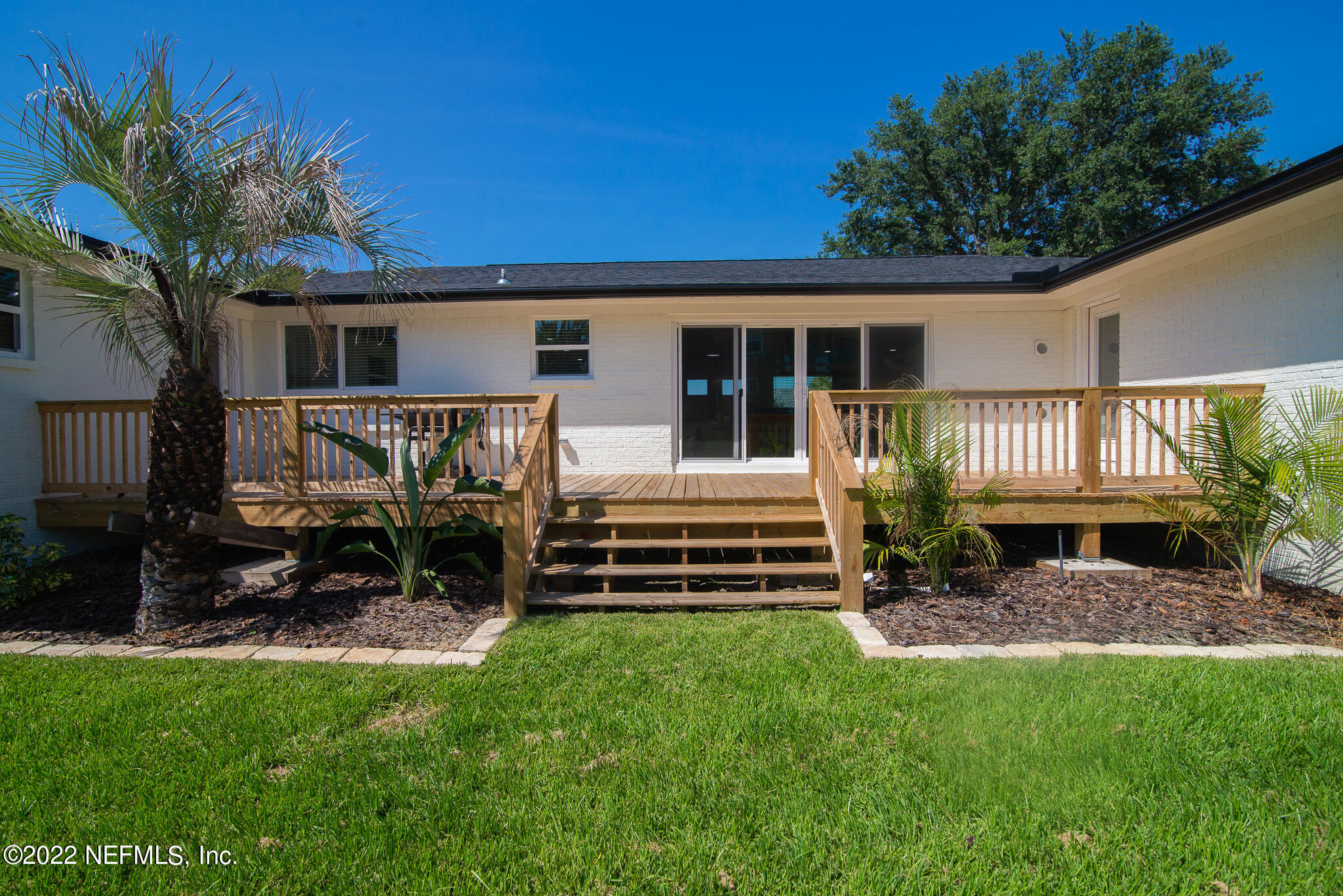 4268 Heath Road Jacksonville, FL 32277 - Photo 7 of 43 a view of a house with backyard and a sitting area