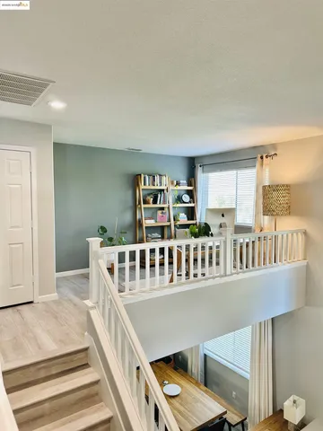 a view of a balcony with furniture