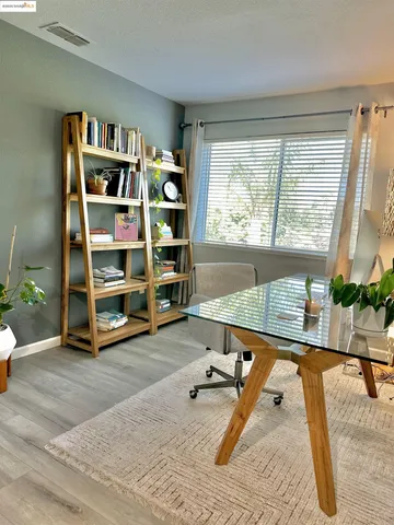 a room with gym equipment and a large window