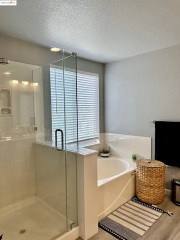 a bathroom with a bathtub and a shower