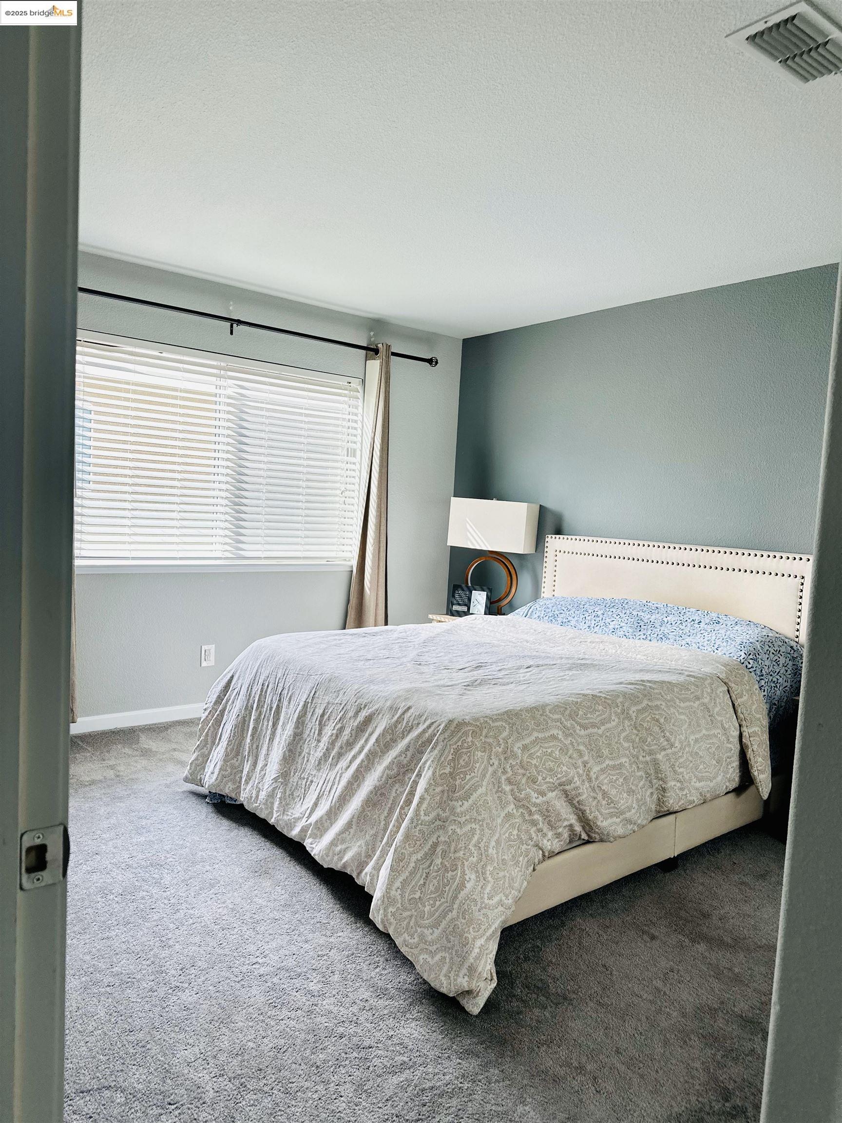 4519 Twin Creeks Court Tracy, CA 95377 - Photo 21 of 34 a bedroom with a bed and a window