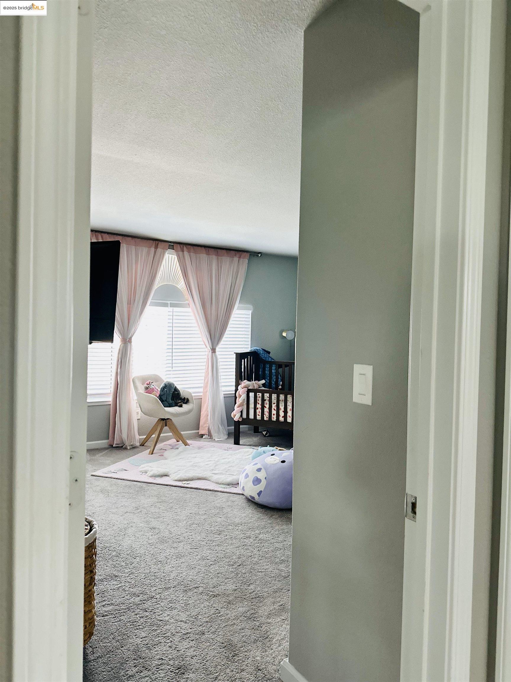 4519 Twin Creeks Court Tracy, CA 95377 - Photo 24 of 34 a room with a wooden floor and a window