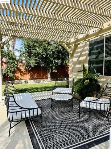a view of a patio with a bench