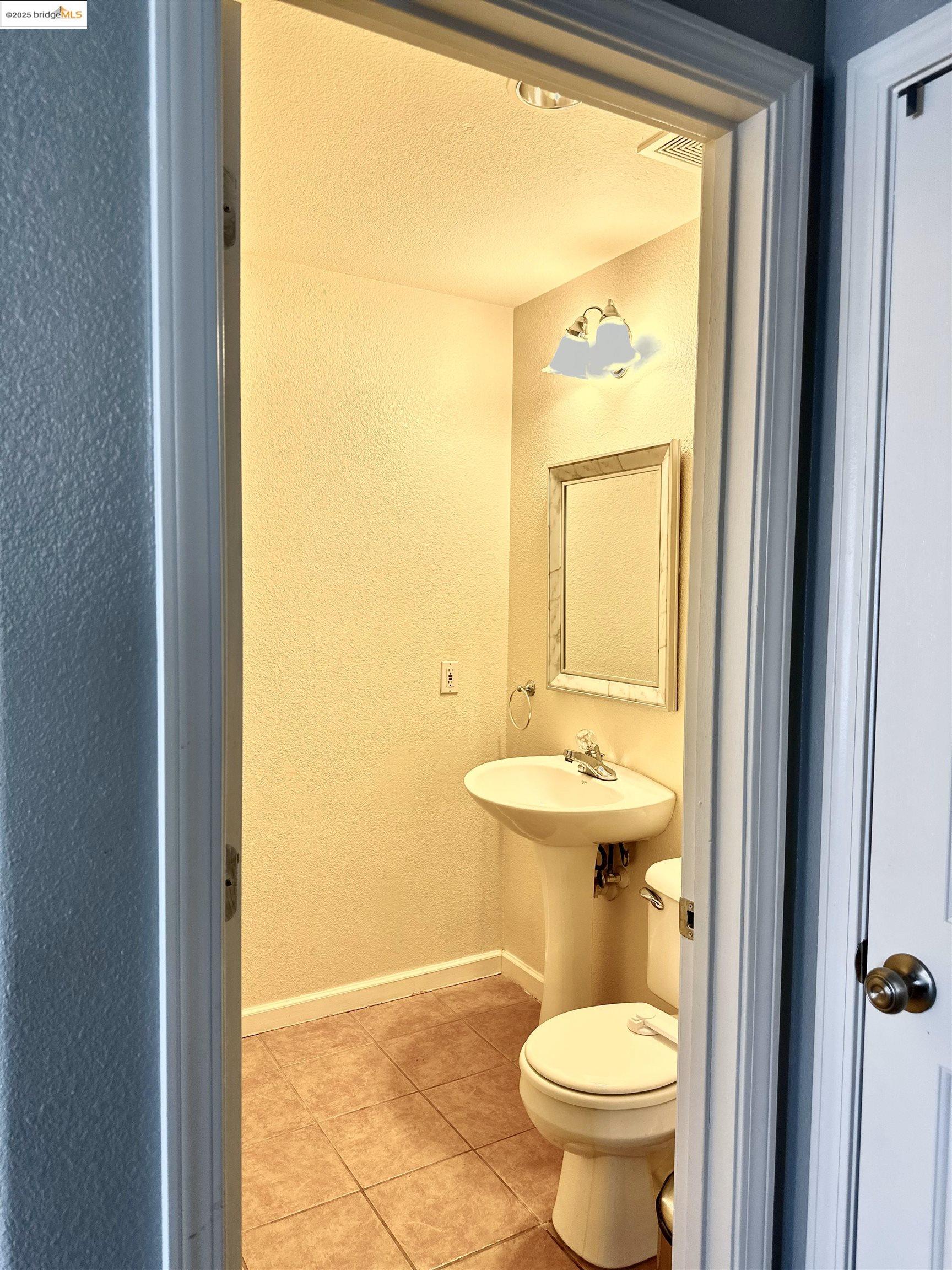 4519 Twin Creeks Court Tracy, CA 95377 - Photo 29 of 34 a bathroom with a sink and a toilet