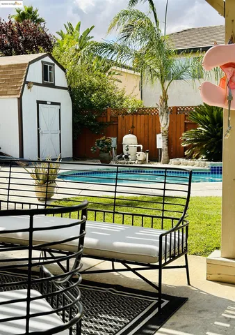 a view of swimming pool with seating area