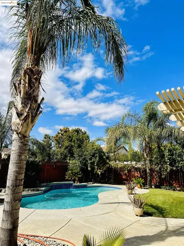 a view of a yard and front view of a house
