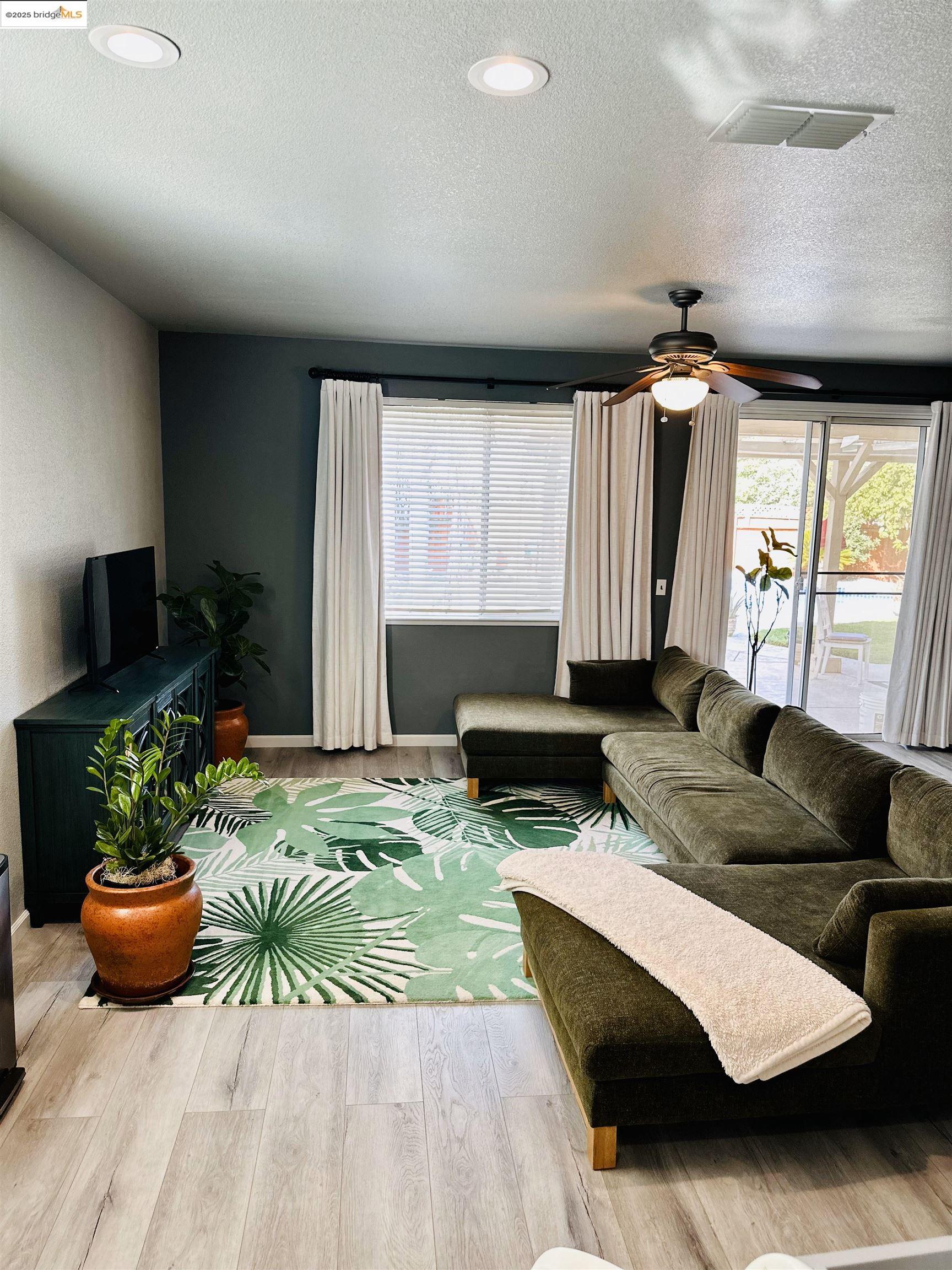 4519 Twin Creeks Court Tracy, CA 95377 - Photo 5 of 34 a living room with furniture and a large window