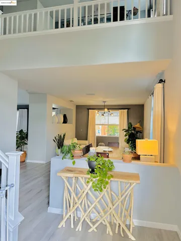 a living room with furniture windows and wooden floor
