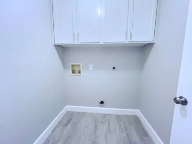 a view of an empty room and wooden floor