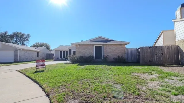 a house view with a garden space